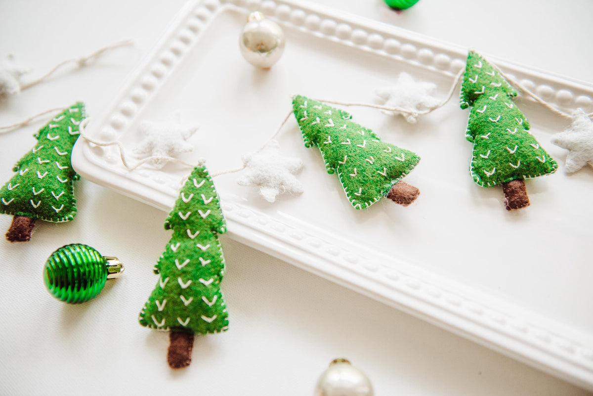 Felt Christmas Garland featuring tiny green christmas trees and white stars. Perfect christmas garland for mantle.
